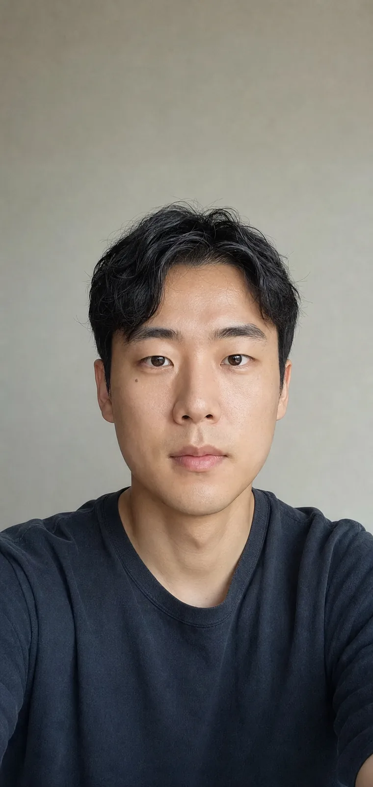 Synthetic source portrait for case 01, a 28-year-old East Asian man