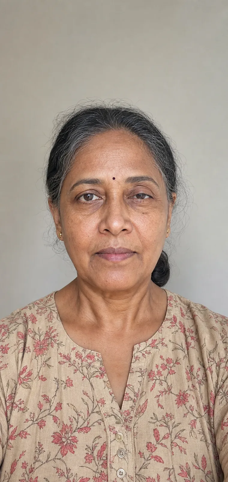 Synthetic source portrait for case 04, a 58-year-old South Asian woman