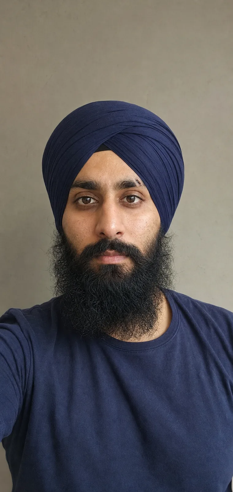 Synthetic source portrait for case 14, a 33-year-old South Asian Sikh man